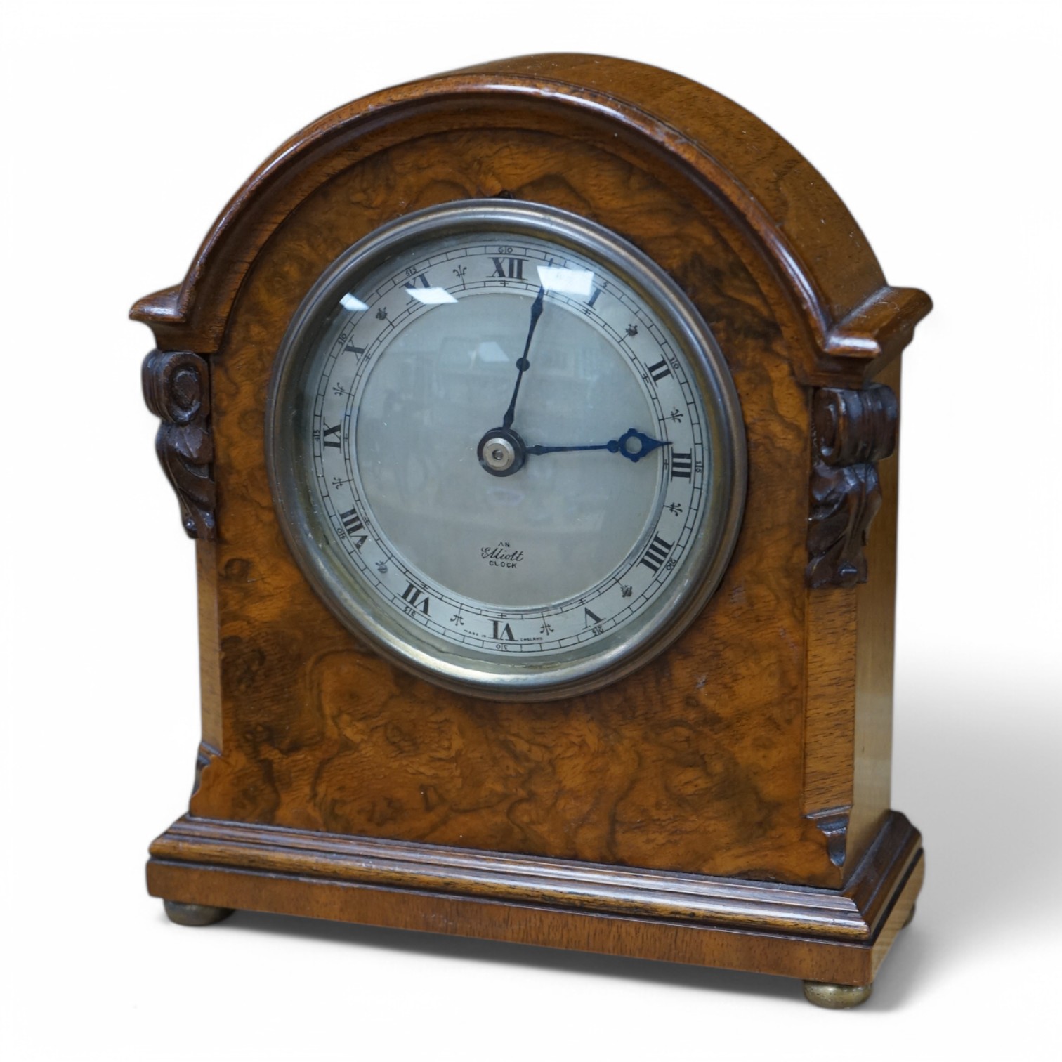 An Elliot burr walnut mantel timepiece, 18cm high. Condition - good.